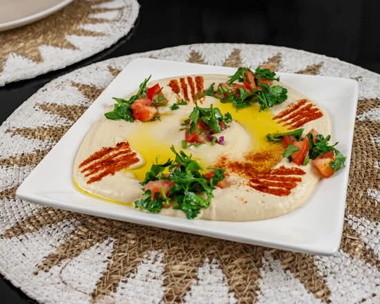 Freshly blended hummus with olive oil
