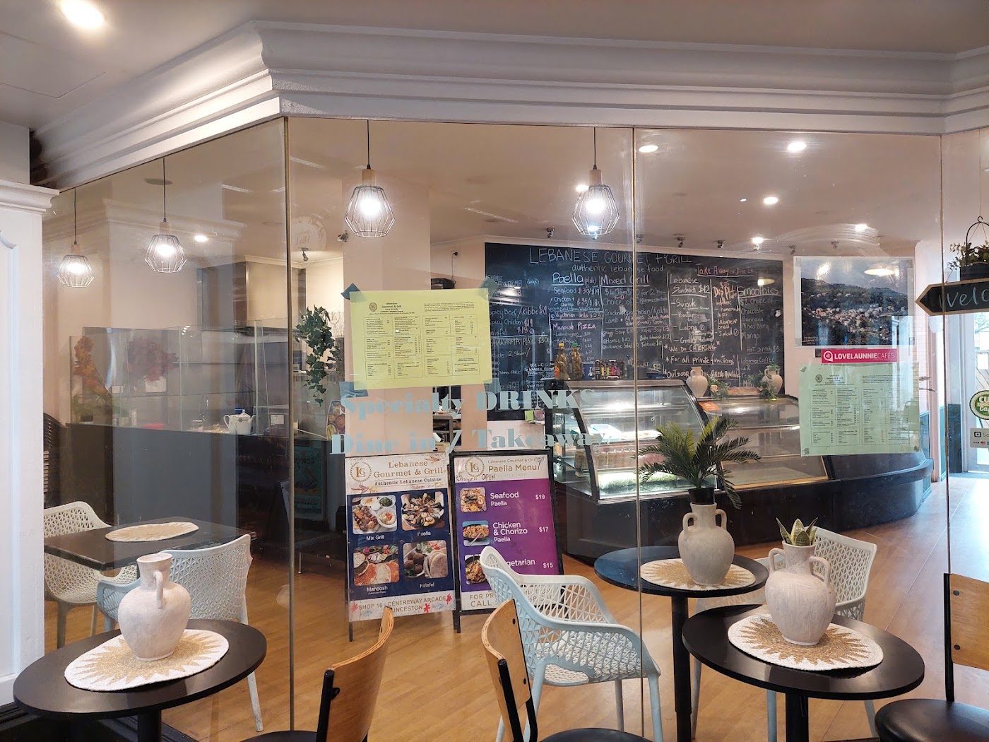 Dining area and counter seen through the shopfront